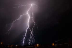 branched lightning strike behind houses lights up 2021 08 29 17 28 53 utc